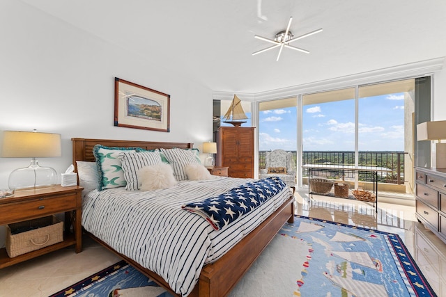 tiled bedroom featuring access to exterior and a wall of windows