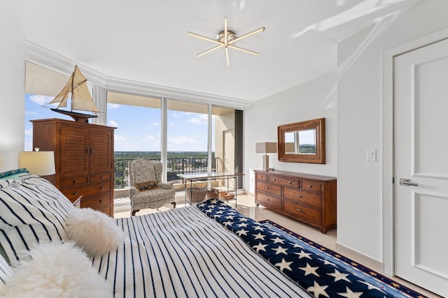 bedroom featuring access to exterior and expansive windows