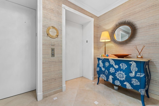 hall featuring elevator, ornamental molding, and tile patterned flooring