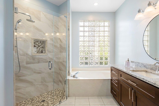 bathroom with vanity, separate shower and tub, and tile patterned floors