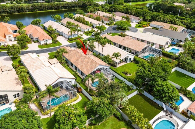 birds eye view of property featuring a water view