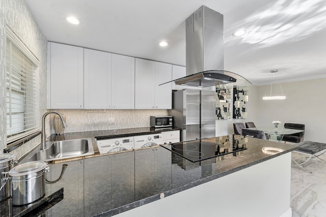 kitchen with white cabinetry, island range hood, sink, and dark stone counters