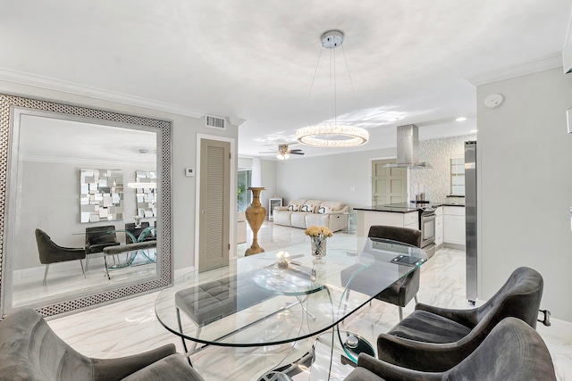 dining room featuring ceiling fan and ornamental molding