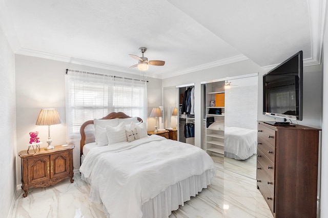 bedroom with a closet, a spacious closet, ceiling fan, and crown molding