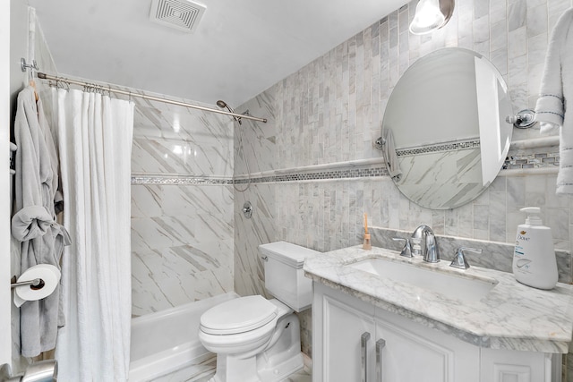 bathroom featuring curtained shower, vanity, tile walls, and toilet