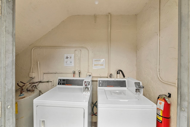 washroom with independent washer and dryer and gas water heater