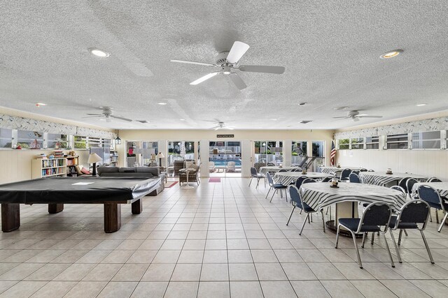 1100 NW 13th St Unit 292D, Boca Raton, FL 33486 - community laundry with washing machine and clothes dryer, water heater, and a textured wall