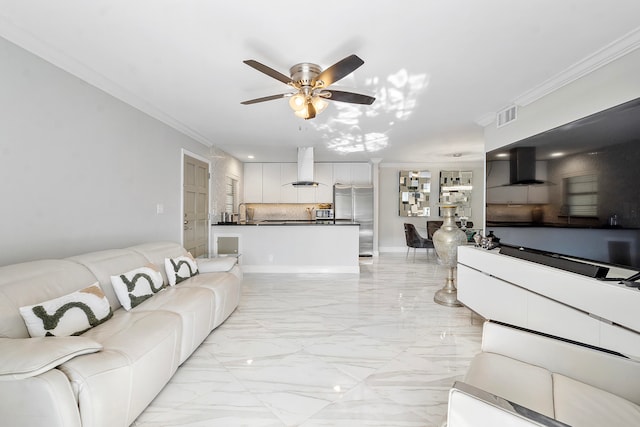 living room featuring ceiling fan and ornamental molding