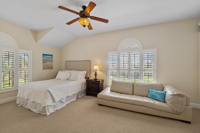 bedroom with carpet, vaulted ceiling, and ceiling fan