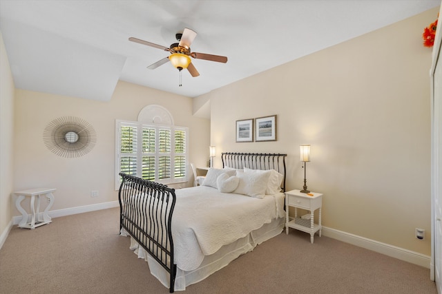 bedroom featuring light carpet and ceiling fan