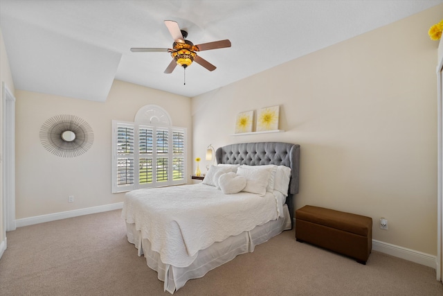 bedroom with ceiling fan and light carpet