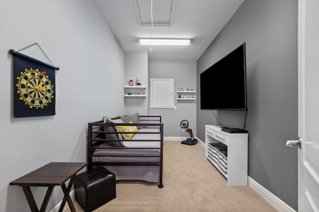 interior space featuring light carpet and a textured ceiling