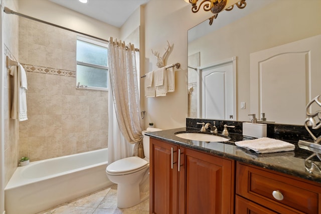 full bathroom with shower / bath combo with shower curtain, tile patterned floors, vanity, and toilet