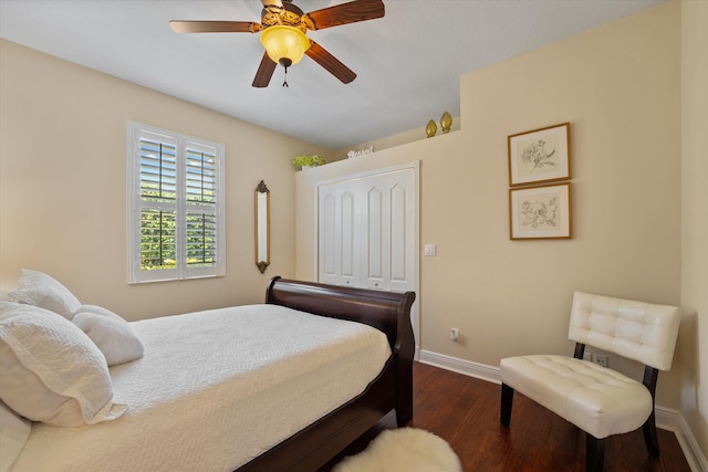 bedroom with a closet, ceiling fan, and dark wood-type flooring