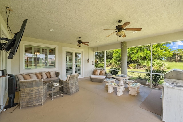 sunroom / solarium with ceiling fan