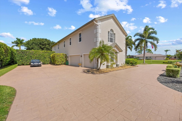 view of property exterior featuring a garage