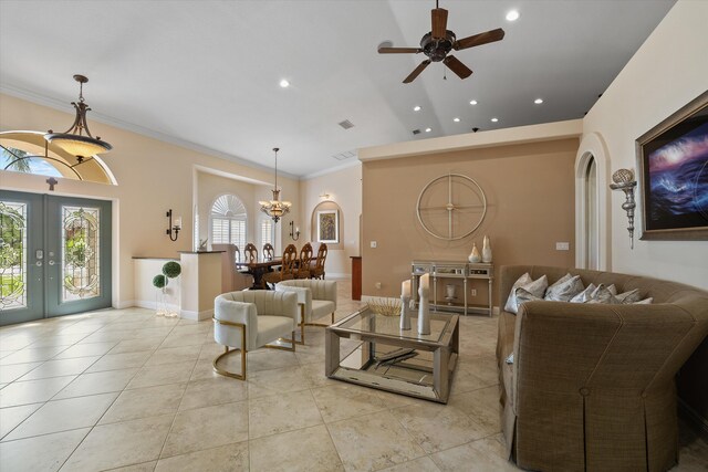 tiled living room featuring crown molding, ceiling fan, and french doors