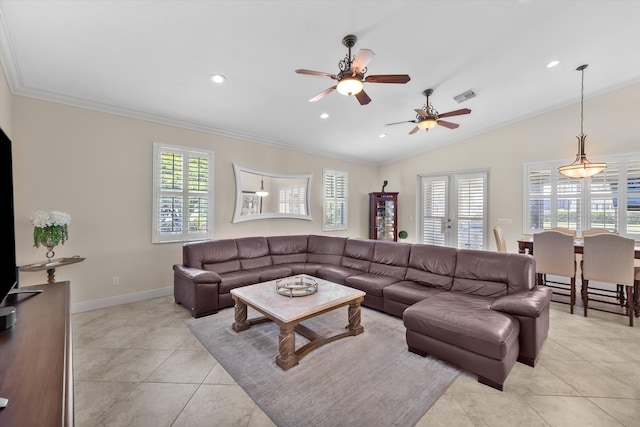 tiled living room featuring ornamental molding, lofted ceiling, and ceiling fan