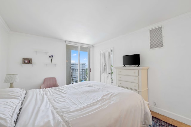 bedroom featuring access to outside, tile patterned flooring, and ornamental molding