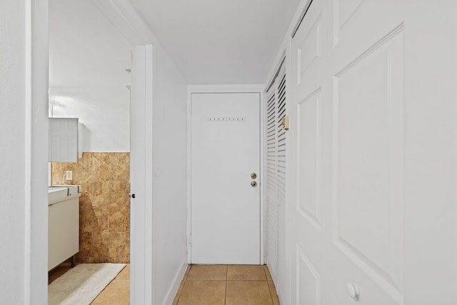 hall with light tile patterned flooring