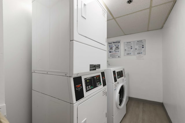 clothes washing area featuring separate washer and dryer, stacked washer / dryer, and light hardwood / wood-style floors