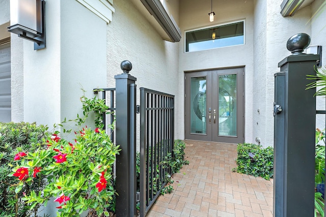 view of exterior entry featuring french doors