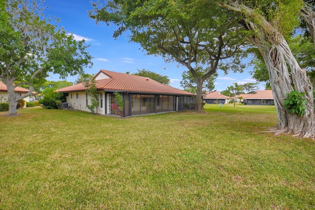 view of yard with a sunroom