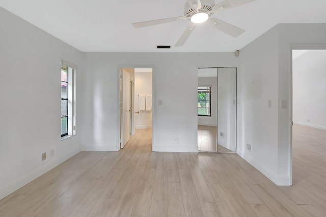 unfurnished room featuring ceiling fan and light hardwood / wood-style flooring