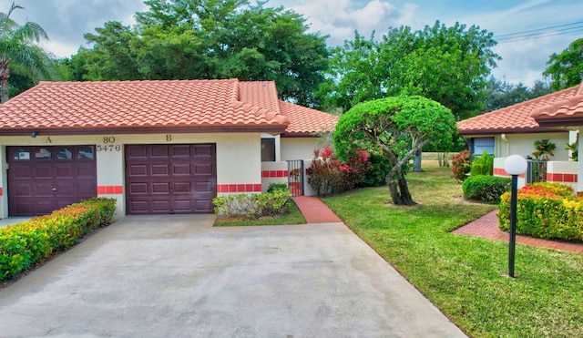 mediterranean / spanish-style house featuring a front lawn