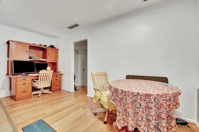 dining area with light wood-type flooring