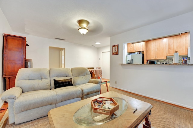 living room with light carpet and ceiling fan