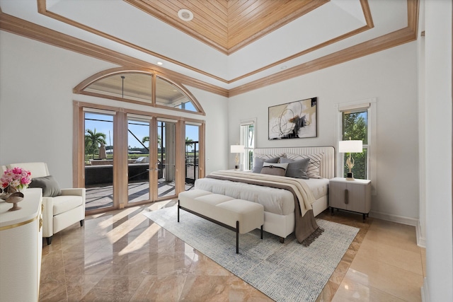 bedroom featuring a towering ceiling, crown molding, and access to outside