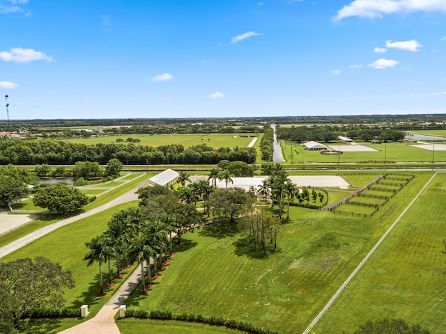 birds eye view of property with a rural view