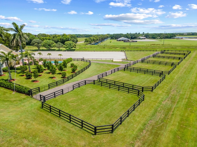 birds eye view of property with a water view and a rural view