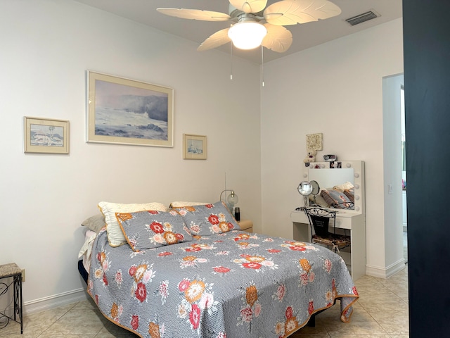 tiled bedroom featuring ceiling fan