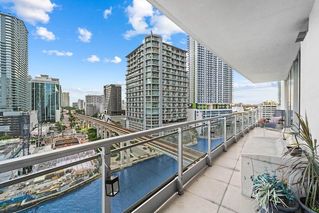 balcony featuring a water view