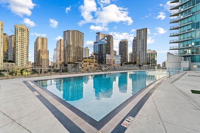 view of swimming pool with a patio