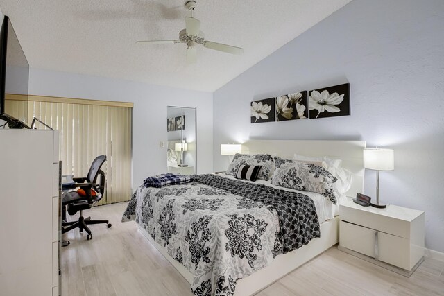 living room featuring light parquet flooring, high vaulted ceiling, and ceiling fan