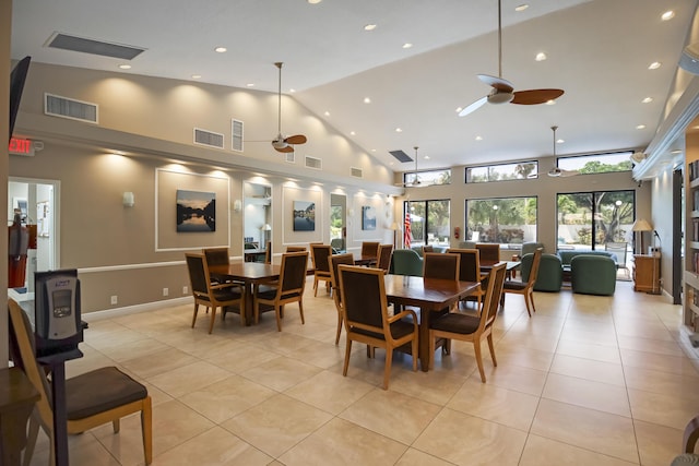 dining space featuring ceiling fan, high vaulted ceiling, and light tile patterned floors