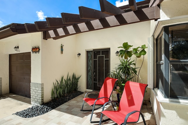 entrance to property featuring a garage