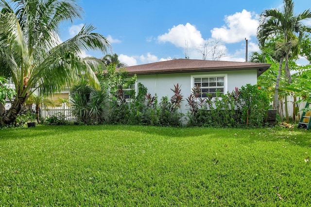 view of property exterior featuring a yard