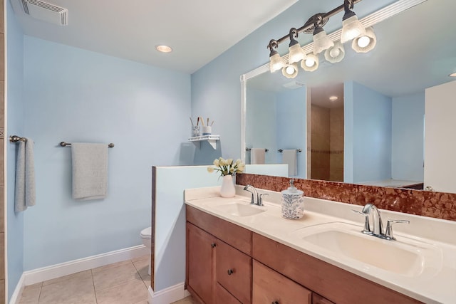 bathroom featuring wooden walls, tile patterned flooring, vanity, and toilet