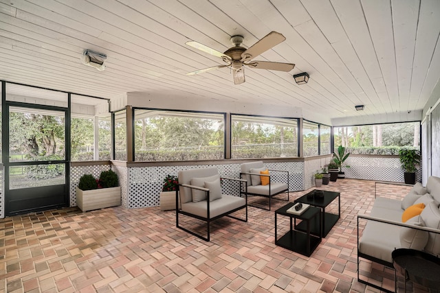 sunroom / solarium featuring ceiling fan and a wealth of natural light