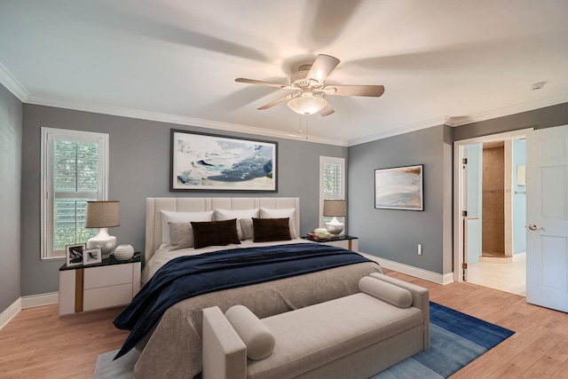 bedroom featuring ceiling fan, crown molding, and light hardwood / wood-style floors