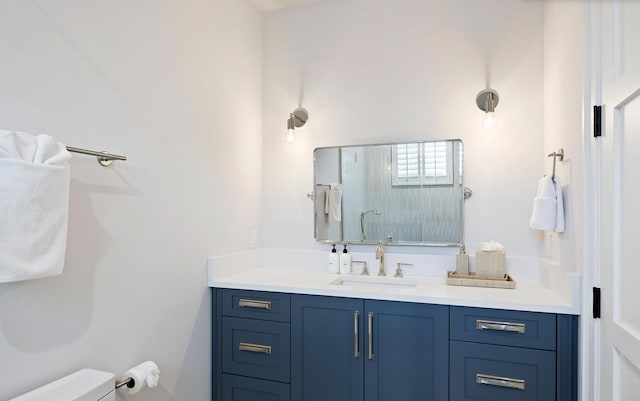 bathroom featuring toilet and vanity