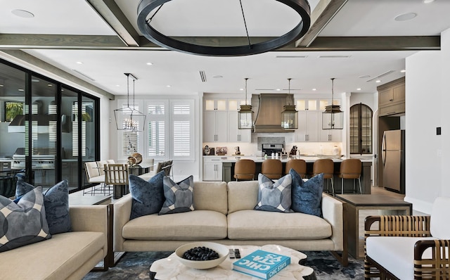 living room featuring beam ceiling and recessed lighting