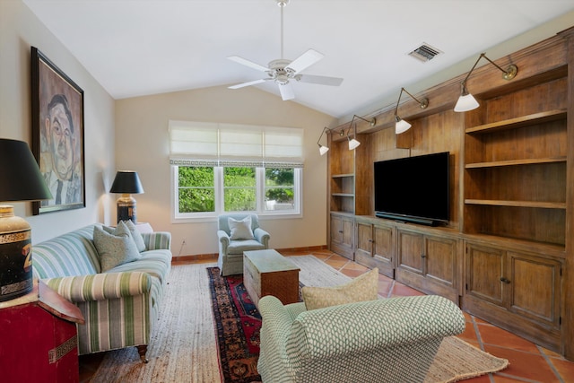 living room featuring ceiling fan, lofted ceiling, and light tile patterned floors