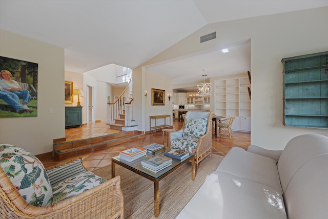 living room featuring lofted ceiling, a chandelier, and tile patterned flooring