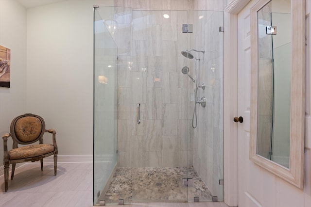 bathroom featuring a shower with shower door and tile patterned floors