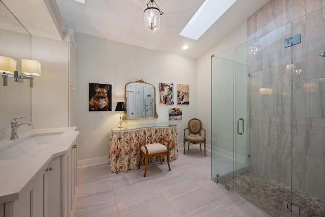 bathroom with vanity, lofted ceiling with skylight, a shower with door, and tile patterned floors